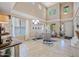 Bright living room features soaring ceilings, large windows, neutral decor, and comfortable seating, ideal for relaxing at 18045 W Rimrock St, Surprise, AZ 85388