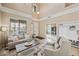 Stylish living room with comfortable seating, neutral colors, and bright natural light, creating a welcoming atmosphere at 18045 W Rimrock St, Surprise, AZ 85388