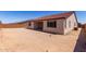 The backyard has zero-scape and a partial covered patio at 20262 W Monterey Way, Buckeye, AZ 85396