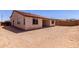 The backyard has zero-scape and a partial covered patio at 20262 W Monterey Way, Buckeye, AZ 85396