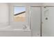 Bathroom featuring a soaking tub, shower, and subway tile surround at 20262 W Monterey Way, Buckeye, AZ 85396