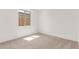 Empty bedroom featuring neutral carpet, white walls and a window at 20262 W Monterey Way, Buckeye, AZ 85396