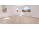 Bright bedroom with large windows offering ample natural light and ceramic tile flooring at 20262 W Monterey Way, Buckeye, AZ 85396