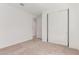 Bedroom featuring neutral carpet, closet and doorway access at 20262 W Monterey Way, Buckeye, AZ 85396