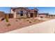 Charming single-Gathering home featuring a terracotta roof, a two-car garage, and desert landscaping at 20262 W Monterey Way, Buckeye, AZ 85396