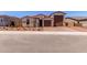 Charming single-Gathering home featuring a low-maintenance front yard and a two-car garage at 20262 W Monterey Way, Buckeye, AZ 85396