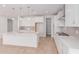 Spacious kitchen boasts custom white cabinetry, quartz countertops, and a walk-in pantry at 20262 W Monterey Way, Buckeye, AZ 85396
