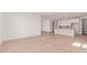 Spacious open living area with ceramic tile, modern kitchen view, and recessed lighting at 20262 W Monterey Way, Buckeye, AZ 85396