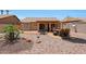 The backyard features a stone patio and desert landscaping at 20739 N 106Th Ave, Peoria, AZ 85382