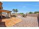 Covered patio and gravel backyard featuring mature landscaping at 20739 N 106Th Ave, Peoria, AZ 85382