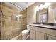 Modern bathroom with tile shower, glass door, and updated vanity at 20739 N 106Th Ave, Peoria, AZ 85382