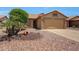 Charming single-story home featuring a well-maintained rock yard and a two-car garage at 20739 N 106Th Ave, Peoria, AZ 85382