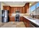 Modern kitchen with stainless steel appliances, tile backsplash, and ample counter space at 20739 N 106Th Ave, Peoria, AZ 85382