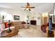 Spacious living room with tile floors, ceiling fan, and stylish furnishings at 20739 N 106Th Ave, Peoria, AZ 85382