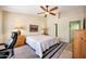 Cozy main bedroom with soft lighting, a ceiling fan, and ample space at 20739 N 106Th Ave, Peoria, AZ 85382