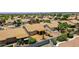 Aerial view of a community of single-Gathering homes with desert landscaping and mountain views at 20739 N 106Th Ave, Peoria, AZ 85382
