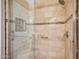 Updated tile shower includes bench seat, niche, and grab bar at 20739 N 106Th Ave, Peoria, AZ 85382