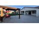 Backyard featuring a wooden pergola, swing, artificial turf, and pavers at 2121 E Aquarius Pl, Chandler, AZ 85249