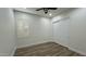 Bright bedroom with wood-look floors, large window with shutters, and closet at 2121 E Aquarius Pl, Chandler, AZ 85249
