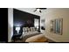 Stylishly appointed bedroom featuring black accent wall, ceiling fan, and contemporary décor at 2121 E Aquarius Pl, Chandler, AZ 85249