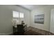 Office space featuring plantation shutters, desk, and natural light at 2121 E Aquarius Pl, Chandler, AZ 85249
