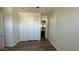 Spacious bedroom showcasing wood-look floors, closet, and adjoining bathroom at 2121 E Aquarius Pl, Chandler, AZ 85249