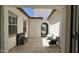 Beautiful courtyard with seating area, water feature and view of decorative gate at 2121 E Aquarius Pl, Chandler, AZ 85249