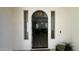 Elegant entryway boasting modern chandelier and tall windows that leads into the living space at 2121 E Aquarius Pl, Chandler, AZ 85249