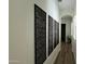 Hallway featuring unique decorative wall art and hardwood flooring at 2121 E Aquarius Pl, Chandler, AZ 85249