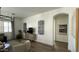 Bright living room with hardwood floors, neutral decor, and modern chandelier lighting fixture at 2121 E Aquarius Pl, Chandler, AZ 85249