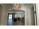 Inviting living room with ample natural light, stylish furnishings, and modern light fixture at 2121 E Aquarius Pl, Chandler, AZ 85249