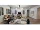 Stunning living room with a stylish chandelier, wood floors, neutral walls, and comfortable seating at 2121 E Aquarius Pl, Chandler, AZ 85249