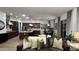 Open-concept living space featuring a gourmet kitchen, dining area, and spacious living room with plush seating at 2121 E Aquarius Pl, Chandler, AZ 85249