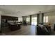 Open-concept living space featuring kitchen, dining area and living room with ample natural light at 2121 E Aquarius Pl, Chandler, AZ 85249