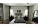Main bedroom with a neutral palette, accent pillows, and wood-look flooring at 2121 E Aquarius Pl, Chandler, AZ 85249