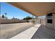 Spacious backyard featuring covered patio and block wall fencing at 23638 N 41St Ave, Glendale, AZ 85310
