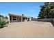 Wide shot of a large, sunny, and open backyard with a covered patio at 23638 N 41St Ave, Glendale, AZ 85310