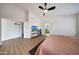 Spacious bedroom with wood-look floors and ceiling fan at 23638 N 41St Ave, Glendale, AZ 85310