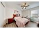 Cozy bedroom features wood-look floors, a ceiling fan, and a vanity at 23638 N 41St Ave, Glendale, AZ 85310