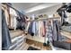 Walk-in closet featuring built-in shelving and ample storage space at 23638 N 41St Ave, Glendale, AZ 85310