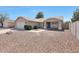 A single-story house with a desert-style front yard offers low maintenance, complemented by a detached garage at 23638 N 41St Ave, Glendale, AZ 85310