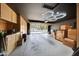 Spacious garage with overhead lighting and abundant storage cabinets at 23638 N 41St Ave, Glendale, AZ 85310