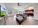 The living area offers stylish wood floors and a view of the kitchen, with easy access to the outdoor space at 23638 N 41St Ave, Glendale, AZ 85310