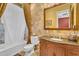 Charming bathroom with a tub-shower combo, neutral tiling, and stylish vanity, creating a relaxing atmosphere at 2371 E Sanoque Ct, Gilbert, AZ 85298