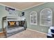 This bedroom features a bunk bed and large arched windows with stylish white shutters at 2371 E Sanoque Ct, Gilbert, AZ 85298