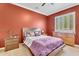 Cozy bedroom with a large window providing natural light and a comfortable space with classic furnishings at 2371 E Sanoque Ct, Gilbert, AZ 85298
