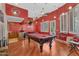 Spacious game room featuring a pool table, bar area, and unique decorative touches, perfect for entertaining guests at 2371 E Sanoque Ct, Gilbert, AZ 85298
