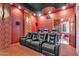 Home theater room featuring recliner seats and a projector at 2371 E Sanoque Ct, Gilbert, AZ 85298