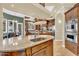 Spacious kitchen with granite counters, custom cabinets, and stainless steel appliances at 2371 E Sanoque Ct, Gilbert, AZ 85298