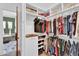 Spacious walk-in closet with ample shelving and hanging space, providing plenty of room for storage at 2371 E Sanoque Ct, Gilbert, AZ 85298